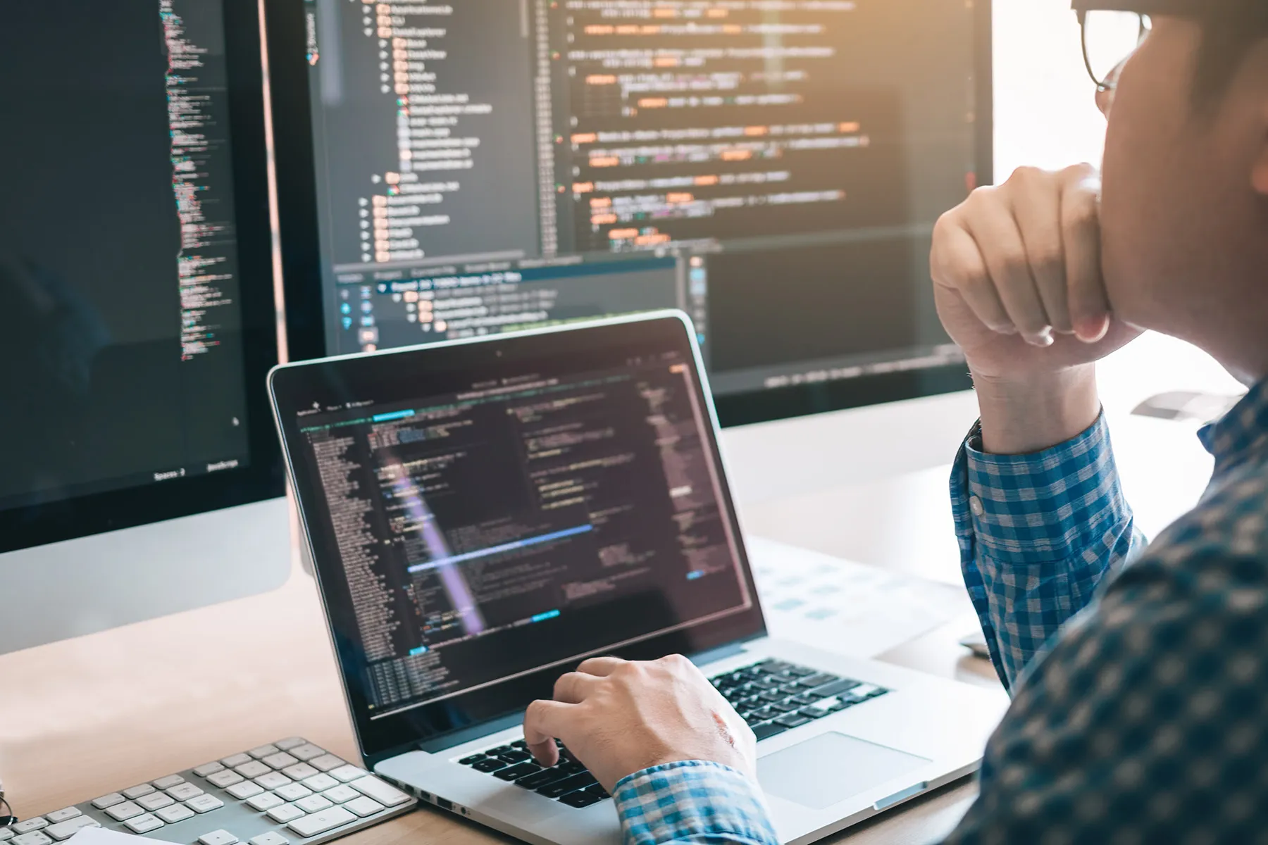 A developer working on a laptop