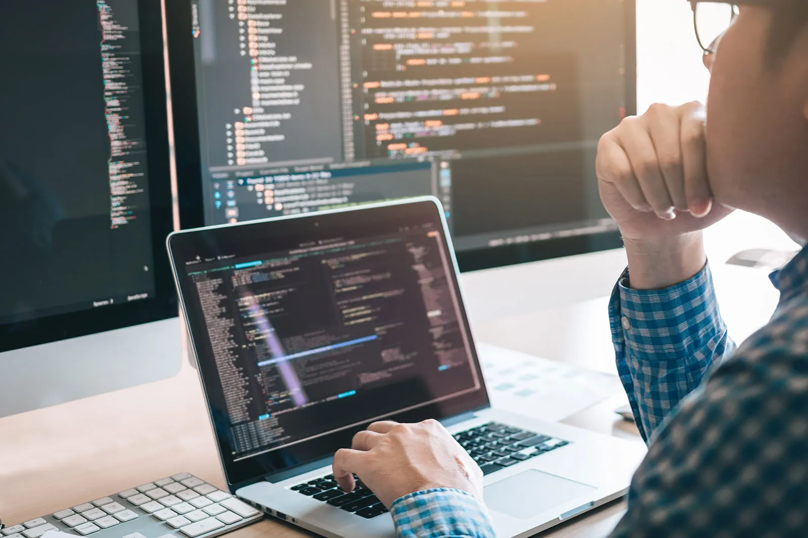 A developer working on a laptop